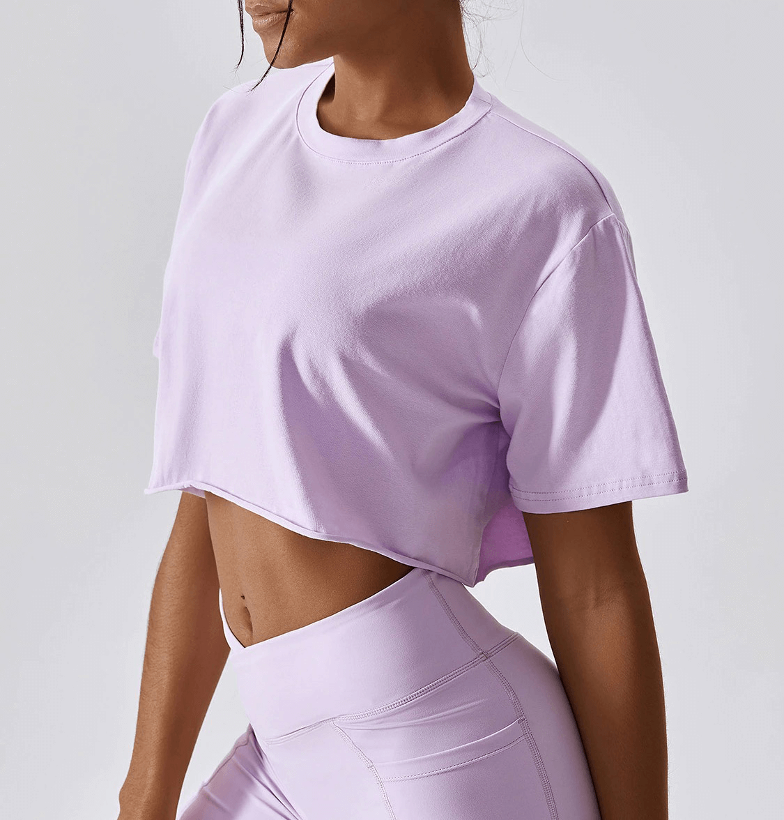 Women's lavender sports crop top, perfect for yoga, running, and training, featuring breathable polyester blend and stylish O-neck design.